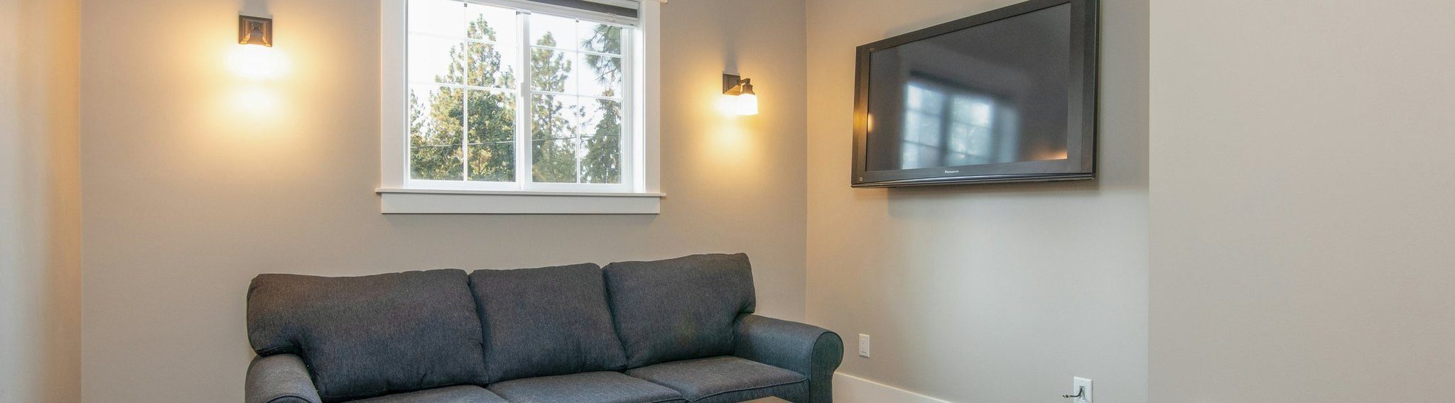 Finished garage suite living room with vaulted ceiling