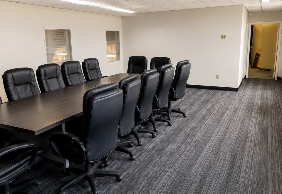 Finished commercial boardroom interior with meeting table and chairs